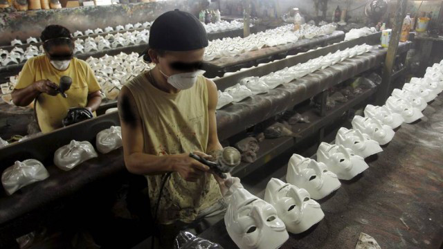 anonymous mask being created in sweatshop